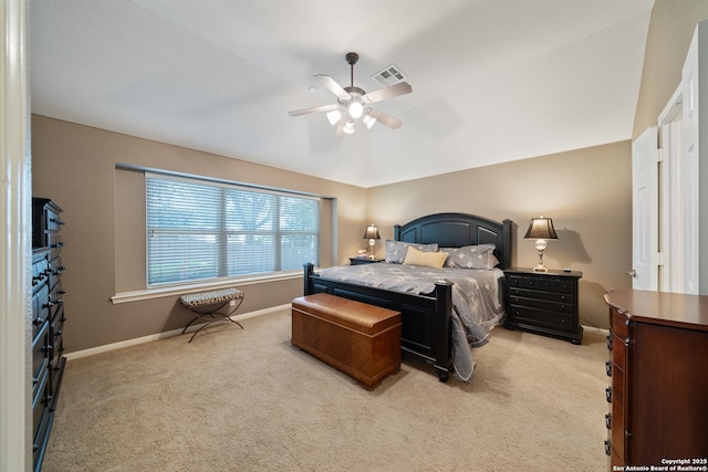 bedroom with light colored carpet, baseboards, and a ceiling fan