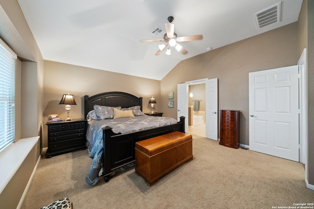 bedroom featuring lofted ceiling, carpet flooring, connected bathroom, ceiling fan, and baseboards