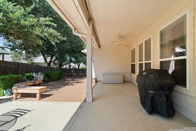 view of patio featuring a ceiling fan, fence, and a grill
