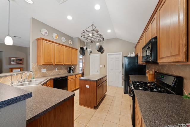 kitchen featuring black appliances, vaulted ceiling, a sink, a kitchen island, and tasteful backsplash