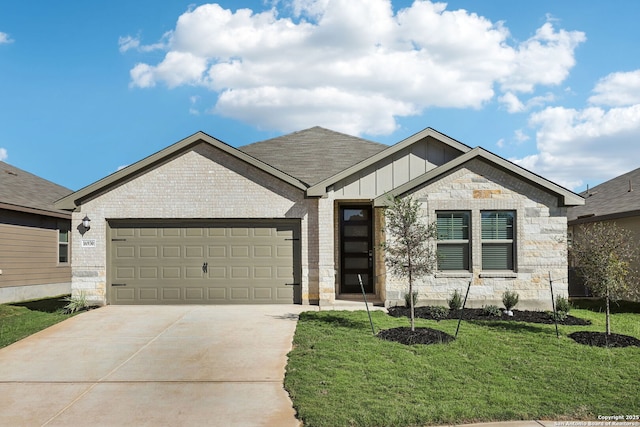 ranch-style house with board and batten siding, a garage, concrete driveway, brick siding, and a front yard