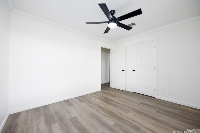 15031 Geronimo, San Antonio, TX 78254 - unfurnished bedroom featuring wood finished floors, baseboards, ornamental molding, and ceiling fan