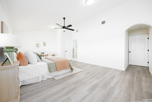 15031 Geronimo, San Antonio, TX 78254 - bedroom featuring arched walkways, light wood finished floors, crown molding, baseboards, and ceiling fan