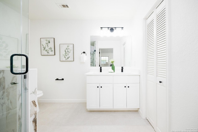15031 Geronimo, San Antonio, TX 78254 - full bathroom with a marble finish shower, baseboards, toilet, a closet, and double vanity