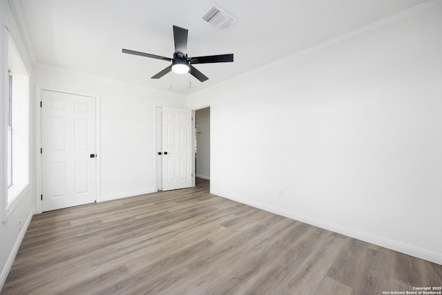 15031 Geronimo, San Antonio, TX 78254 - unfurnished bedroom featuring wood finished floors, baseboards, ornamental molding, and a ceiling fan