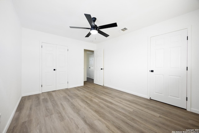 15031 Geronimo, San Antonio, TX 78254 - unfurnished bedroom featuring wood finished floors, baseboards, a closet, and a ceiling fan