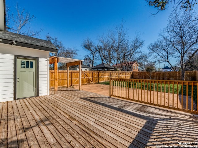 deck with a fenced backyard