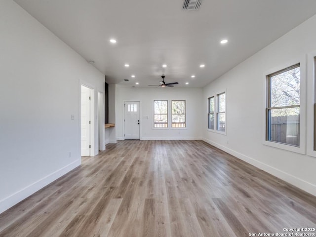 unfurnished living room featuring recessed lighting, baseboards, light wood finished floors, and a ceiling fan