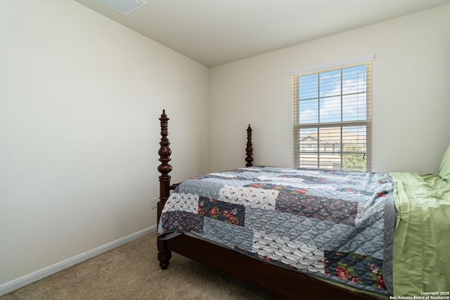 carpeted bedroom featuring baseboards