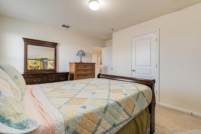 carpeted bedroom with baseboards