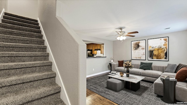 220 Trestle Tree Unit 112, San Marcos, TX 78666 - living area featuring stairs, wood finished floors, ceiling fan, and baseboards