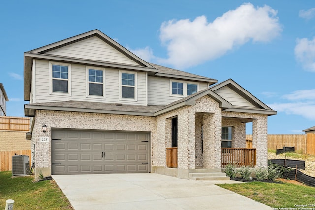 view of front facade with covered porch, central air condition unit, fence, an attached garage, and concrete driveway