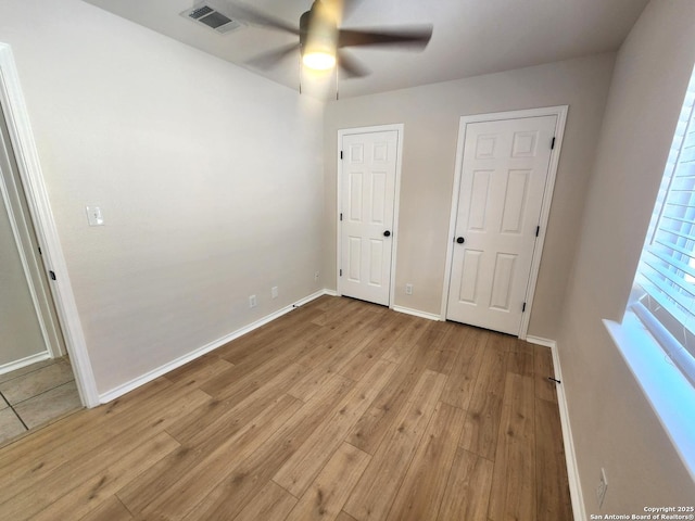9639 Wild Horse, San Antonio, TX 78251 - unfurnished bedroom with light wood-type flooring, baseboards, and ceiling fan