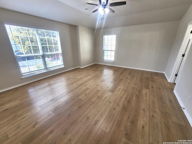 9639 Wild Horse, San Antonio, TX 78251 - unfurnished room with a ceiling fan, hardwood / wood-style flooring, and baseboards