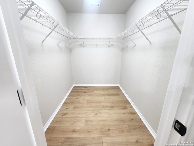 9639 Wild Horse, San Antonio, TX 78251 - walk in closet featuring light wood-type flooring