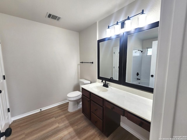 9639 Wild Horse, San Antonio, TX 78251 - bathroom with wood finished floors, vanity, toilet, baseboards, and  shower combination
