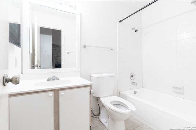 bathroom with toilet, vanity, washtub / shower combination, and tile patterned floors