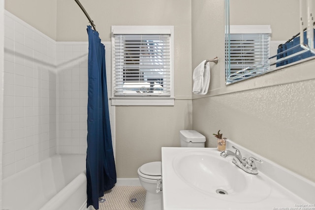 bathroom with toilet, tile patterned floors, shower / bath combo, and vanity