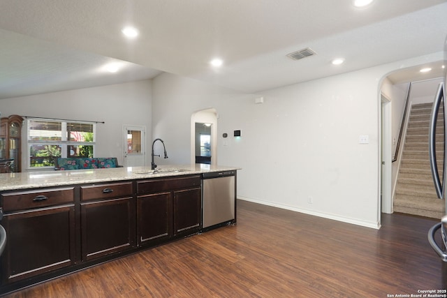 13340 Hackney Pony, San Antonio, TX 78254 - kitchen featuring stainless steel dishwasher, arched walkways, a sink, dark wood-style flooring, and vaulted ceiling