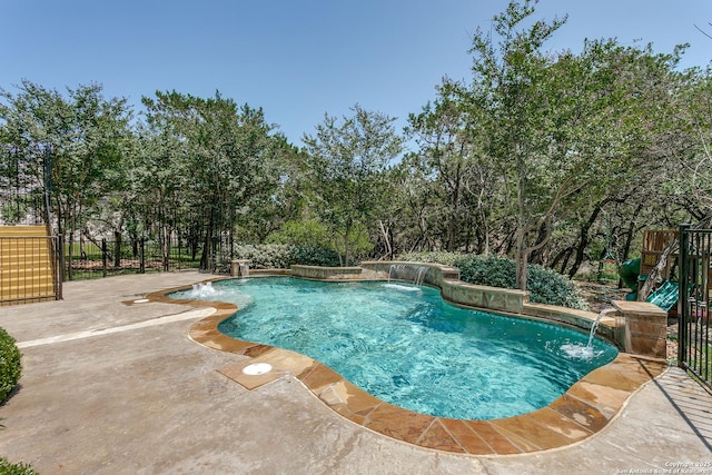 8826 Falcon Pl, San Antonio, TX 78256 - view of swimming pool featuring a patio, fence, and view of scattered trees