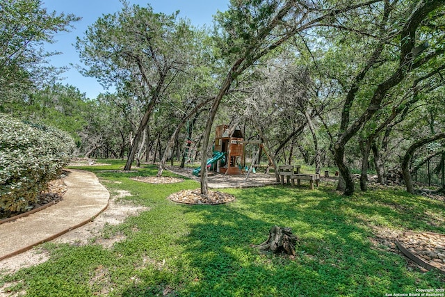 8826 Falcon Pl, San Antonio, TX 78256 - view of grassy yard featuring a playground