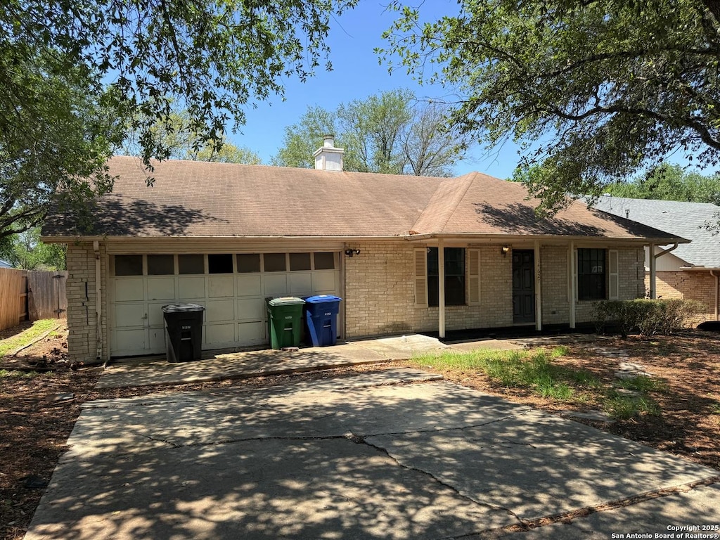 14627 Highland Rdg, San Antonio, TX 78233 - single story home featuring brick siding, driveway, a garage, a chimney, and fence