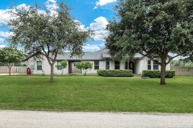 single story home with brick siding and roof with shingles