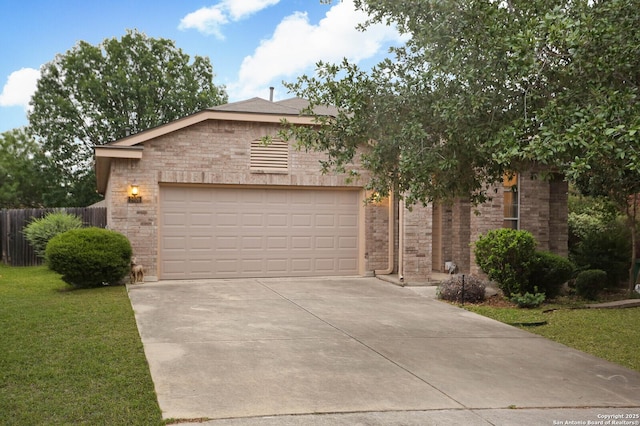 view of front of house with brick siding, driveway, and a garage