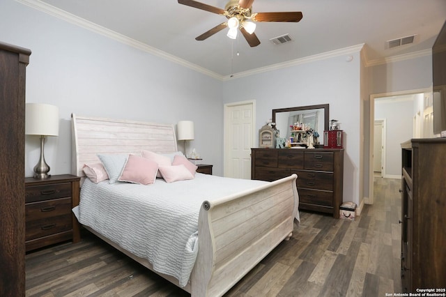 bedroom featuring dark wood-type flooring, crown molding, a ceiling fan, and baseboards