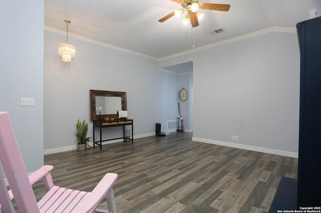 living area featuring a ceiling fan, wood finished floors, baseboards, and crown molding