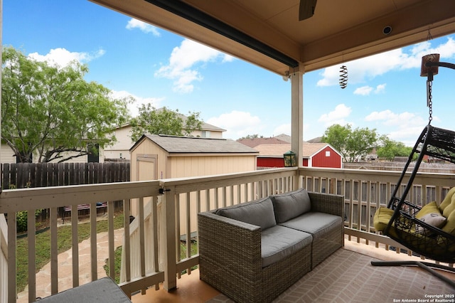 balcony featuring an outdoor living space and a ceiling fan