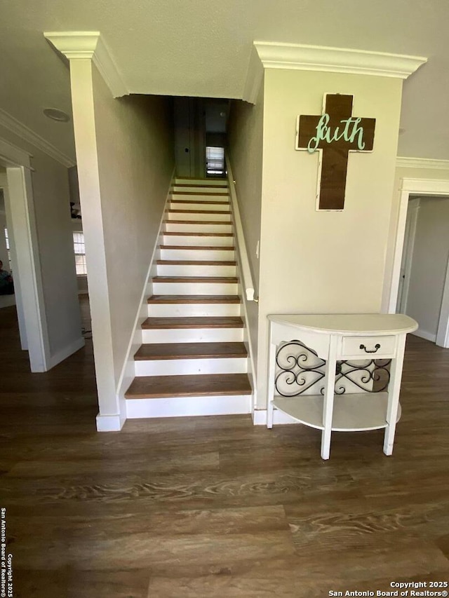 606 S Phelps St, Dilley, TX 78017 - stairs featuring ornamental molding, wood finished floors, and baseboards