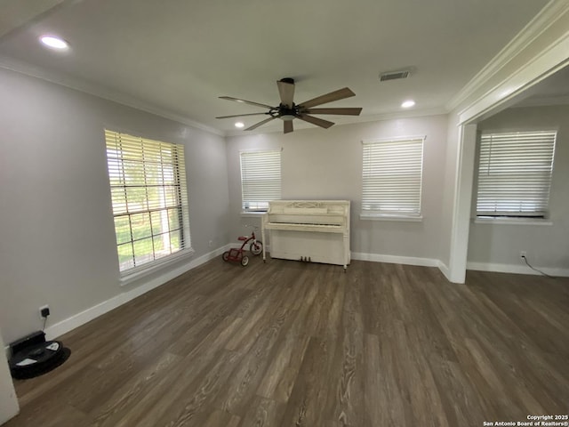 606 S Phelps St, Dilley, TX 78017 - unfurnished living room with crown molding, a ceiling fan, dark wood-style flooring, baseboards, and recessed lighting