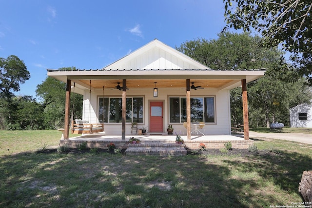 6160 Fm 2538, Marion, TX 78124 - view of front of home featuring a ceiling fan, a front yard, and board and batten siding