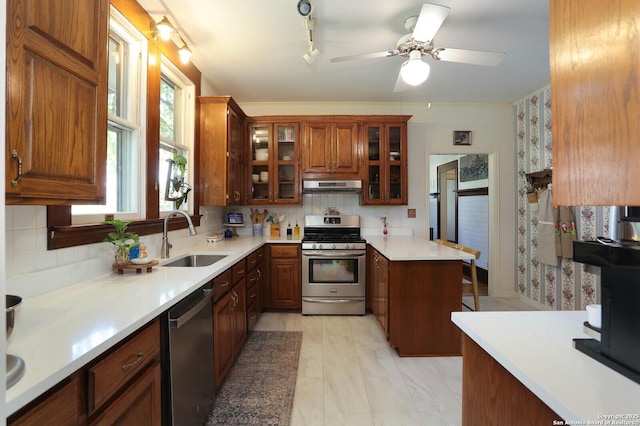 6160 Fm 2538, Marion, TX 78124 - kitchen with stainless steel appliances, a sink, under cabinet range hood, and decorative backsplash