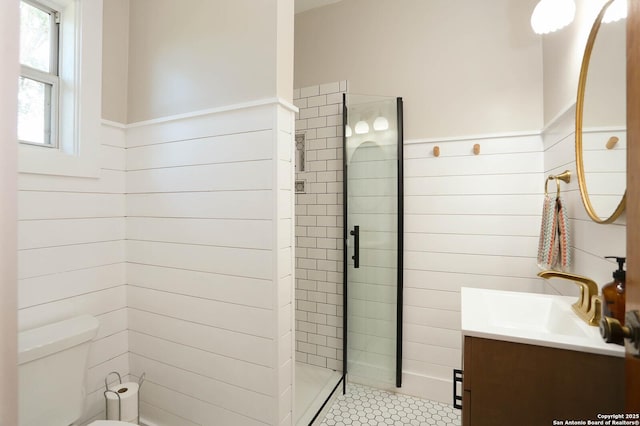 6160 Fm 2538, Marion, TX 78124 - full bathroom featuring wainscoting, vanity, tiled shower, toilet, and wood walls