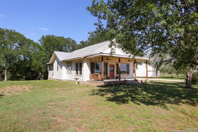6160 Fm 2538, Marion, TX 78124 - view of front facade featuring ceiling fan, a front lawn, and metal roof