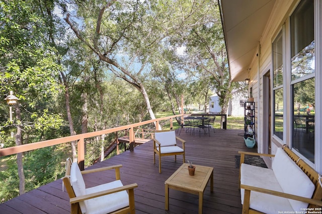 6160 Fm 2538, Marion, TX 78124 - wooden terrace featuring outdoor dining area and view of scattered trees