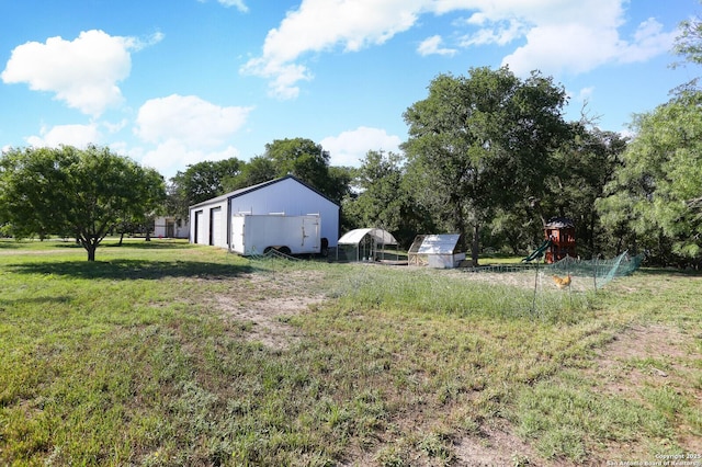 6160 Fm 2538, Marion, TX 78124 - view of grassy yard featuring an outdoor structure and a garage