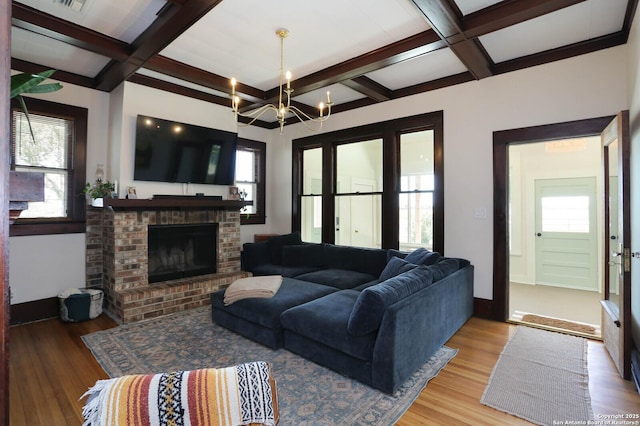 6160 Fm 2538, Marion, TX 78124 - living area with coffered ceiling, light wood-style floors, a chandelier, plenty of natural light, and beamed ceiling