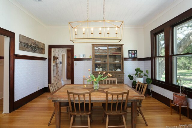 6160 Fm 2538, Marion, TX 78124 - dining space with wood finished floors, crown molding, and wallpapered walls