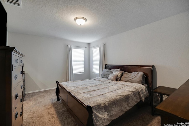 6039 Olson Blfs, San Antonio, TX 78252 - bedroom with carpet flooring, a textured ceiling, and baseboards