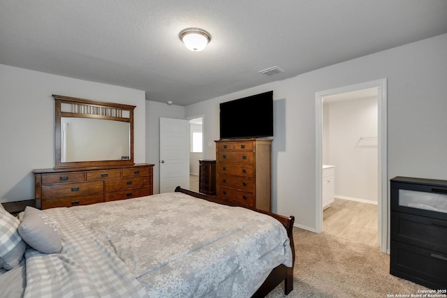 6039 Olson Blfs, San Antonio, TX 78252 - carpeted bedroom with baseboards and ensuite bath