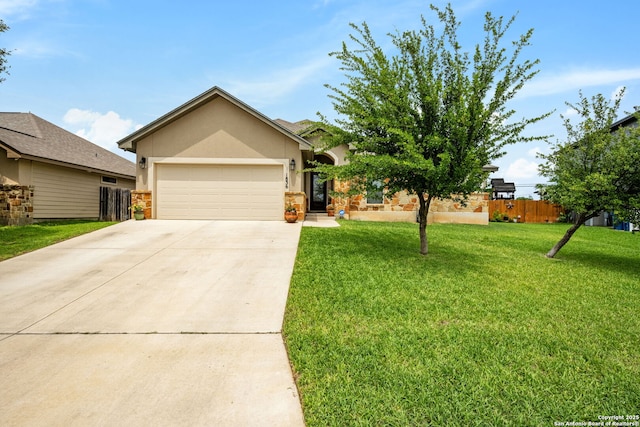 view of front of property with stucco siding, a garage, driveway, and stone siding