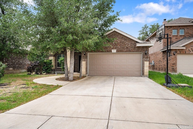 8707 Kallison Arbor, San Antonio, TX 78254 - view of property hidden behind natural elements with concrete driveway, a garage, and brick siding