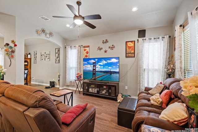 8707 Kallison Arbor, San Antonio, TX 78254 - living area featuring wood finished floors, ceiling fan, arched walkways, baseboards, and vaulted ceiling