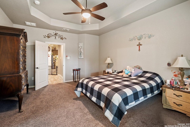8707 Kallison Arbor, San Antonio, TX 78254 - bedroom featuring carpet floors, a raised ceiling, a ceiling fan, and baseboards