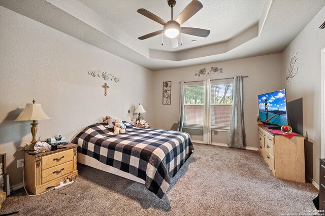 8707 Kallison Arbor, San Antonio, TX 78254 - bedroom with light carpet, a raised ceiling, ceiling fan, and baseboards