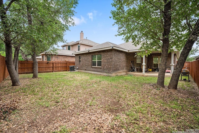 8707 Kallison Arbor, San Antonio, TX 78254 - back of house featuring brick siding, a patio area, and central AC
