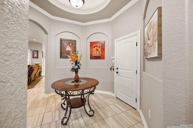 8707 Kallison Arbor, San Antonio, TX 78254 - entrance foyer with arched walkways, light tile patterned flooring, a textured wall, crown molding, and baseboards